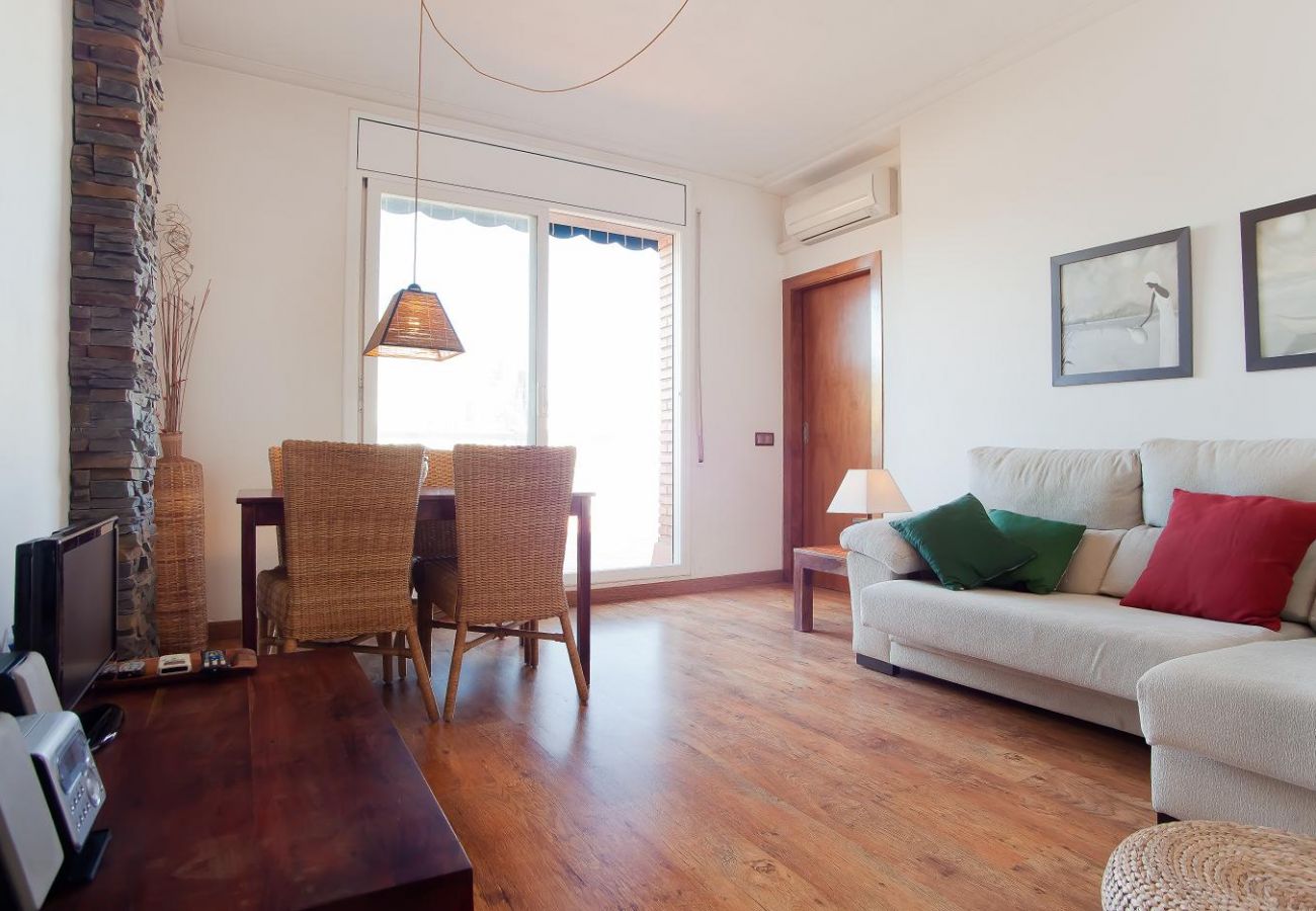 Spacious living room with access to the terrace with views of the Sagrada Família in Barcelona