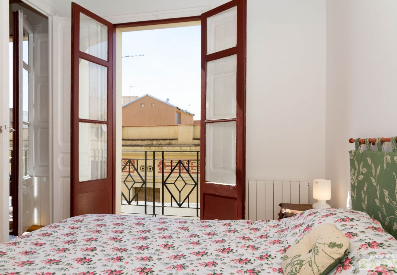 Bedroom with views of the Gracia neighborhood in Barcelona